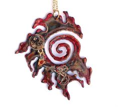 "This one-of-a-kind necklace is handcrafted from metal that has been shaped into a unique flame-like swirl (approximately 2.5\" long), tinted red and gold, and embellished with symbols that recall the Chameleon Arch, antique gears, and red crystals. Hangs on a 16\" chain.   Design belongs to Time Machine Jewelry and is copyright protected TimeMachineJewely U.S. Copyright © 2014  See TIME TRAVEL section for more Whovian items: http://www.etsy.com/shop/TimeMachineJewelry?section_id=10402289" Red Metal Necklace With Large Pendant, Artistic Red Pendant Jewelry, Unique Red Jewelry With Artistic Design, Unique Red Necklace With Large Pendant, Red Spiral Jewelry As Gift, Spiral Shaped Red Jewelry For Gifts, Red Spiral Jewelry For Gifts, Symbolic Red Pendant Necklace, Unique Red Copper Necklace