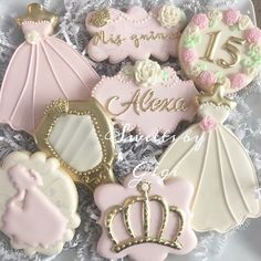 decorated cookies in the shape of princess dresses and tiaras