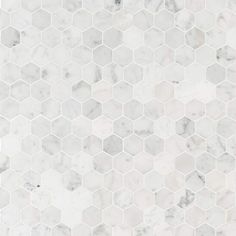 white marble hexagonal tiles with grey veining on the edges and bottoms