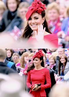 a woman in a red dress and hat waves to the crowd while wearing a red bow on her head