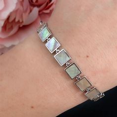 Mother of Pearl, Sterling silver bracelet, adjustable length from 16.5cm to 22cm.  Size of each square link: 8*8mm 💎Natural Ormer Shell (Mother Of Pearl) 💎Sterling Silver  💎Adjustable 16.5cm to 22cm Please contact me if you need a different length and I will be able to do it within 2-3 days.  This bracelet has extra layers of rhodium (type of precious metal, similar to white gold) plated on to the solid sterling silver base to make it anti-tarnish.  We are a very busy local small business so Modern Pearl Bracelet For Gift, Modern Adjustable Pearl Bracelet, Modern Bracelet With Oyster Design For Gifts, Adjustable Modern Pearl Bracelet As Gift, Adjustable Modern Pearl Bracelet For Gift, Modern White Rectangular Bracelet, Mother Of Pearl Bracelet, Beach Bracelet, Design Bracelet