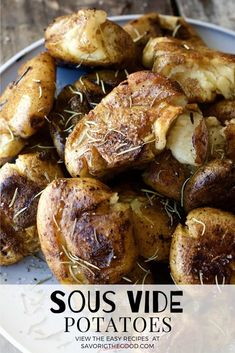 some potatoes are sitting on a white plate with the words sous vide potatoes above it