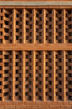 a close up view of a brick wall with vertical bars on the top and bottom