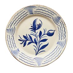 a blue and white plate with an artistic design on the rim that has wavy lines running through it