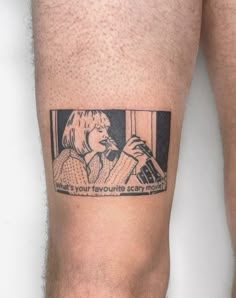 a man with a tattoo on his leg that reads, you're your favorite scary movie