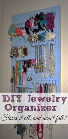 the diy jewelry organizer is organized and ready to be hung up on the wall