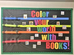 a bulletin board with different colored pencils on it and the words color your world with books