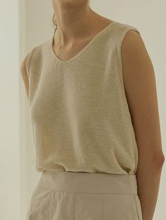 This is a feminine and modern top by MangoManyPlease that is made out of high quality and sturdy material. With distinctive mood of the design and comfortable wear, you can style it for your feminine daily outfit.- Linen blend fabric for summer season- Set up with matching cardigan- Trendy and feminine mood Elegant V-neck Knit Top For Summer, Beige Cotton V-neck Knit Top, Chic Summer Tank Vest, Stretch Sleeveless Sweater Vest For Summer, Summer V-neck Sweater Vest For Day Out, Beige V-neck Tank Top For Summer, Versatile V-neck Knit Top For Summer, Trendy Tank Sweater Vest For Summer, Beige V-neck Cotton Knit Top