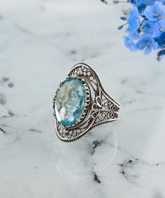 Sky Blue Topaz Silver Victorian Filigree Ring, 925 Sterling Silver Artisan Made Gothic Women Statement Ring, Handmade Floral Cocktail Ring Wedding gift ring, anniversary gift, blue topaz jewelry, oval statement ring, blue gemstone ring Gemstone: Sky Blue Topaz 10x14 mm. -The stone used in this jewelry, Topaz Gemstone, Ring is the November Birthstone and symbolizes love and affection. Material: 925 Sterling Silver ( NICKEL FREE ) A bold and beautiful statement ring, this Filigree Blue Topaz Silver Victorian Floral Ring is stunning. The intricately woven floral design creates a feminine look with the dainty filigree detailing and Topaz gemstone. Our handcrafted 925 Sterling Silver Artisan Made Gothic Wedding Rings are handmade and labor. FREE, FAST AND TRACKABLE SHIPPING FOR ALL EU COUNTRIES Sterling Silver Filigree Topaz Ring, Filigree Blue Topaz Ring For Gift, Silver Filigree Ring With Blue Topaz And Accent Stones, Sterling Silver Topaz Ring With Filigree, Topaz Ring With Intricate Design For Gift, Gift Blue Topaz Ring With Intricate Design, Gift Topaz Ring With Intricate Design, Intricate Design Topaz Ring For Gift, Intricate Design Topaz Ring As Gift