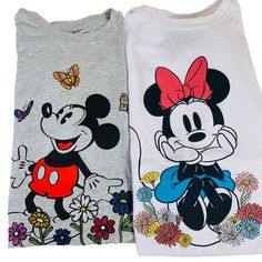 Disney Mickey Minnie Mouse T-Shirt Womens Size Xl Embroidered Lot Of 2 Top In A Charming World Where Iconic Mouse Ears Reign Supreme, This Heather Grey Tee Brings Mickey Mouse To Life Amidst A Garden Of Colorful Blooms. Crafted With A Cotton-Polyester Blend, It Offers Both Comfort And Style. A Timeless Addition To Any Disney Aficionado's Collection, This Shirt Tells A Tale Of Nostalgia And Whimsy. 57% Cotton, 43% Polyester Heather Grey Color And White Mickey Mouse And Minnie Mouse Graphic Design Mickey Mouse Outfit, Mickey Mouse And Minnie Mouse, Mickey Shirt, Shirt Tag, Butterflies And Flowers, Disney Shirt, Disney Merchandise, Mickey Minnie Mouse, Grey Tee