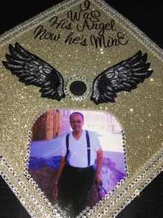 a graduation cap with an image of a man wearing suspenders and wings on it