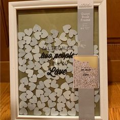 there is a white frame with hearts on it