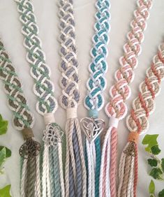 several different colored cords with charms attached to them