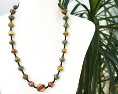 Get 15% off your order when you buy 2 items :) Paper Bead Necklace, Handmade Lacquered Beads, Green Orange Long Necklace, Ceramic Bead, Vintage 1970s Jewelry This is a beautiful necklace made from rolled up paper beads, lacquered shiny, with black glass seed beads. The necklace is from my private collection of 70s necklaces. In perfect condition. the length is 28 inches, with an artisan flat ceramic bead More Fun Exciting Vintage Treasures here: http://www.etsy.com/shop/atVintage Thank you for v Paper Bead Necklace, 1970s Jewelry, Necklace Ceramic, Paper Beads Necklace, 1 November, November 1st, Christmas Gift Jewelry, Paper Beads, Beautiful Necklace