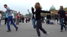 a group of young people playing with a frisbee