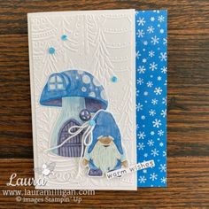 a close up of a card with a gnome and a blue mushroom on it's face