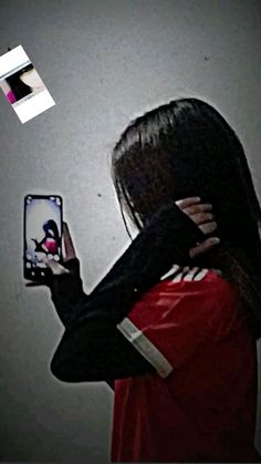 a woman is holding up her cell phone to take a photo with the image of a bird flying over her head