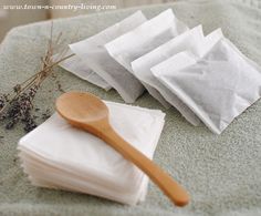 napkins and a wooden spoon sitting on top of a table