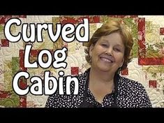 a woman standing in front of a quilt with the words curved log cabin on it