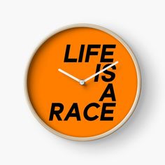 an orange clock with the words life is a race printed on it's face