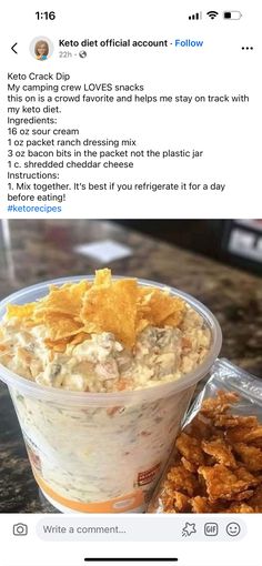 a bowl of food sitting on top of a table next to a container of chips