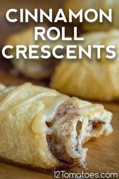 cinnamon roll crescents on a cutting board with the words cinnamon roll crescents over them