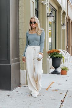 Elevate your loungewear with the effortlessly chic Cream Seam Detail Wide Leg Sweatpants! Designed with a high waisted fit, these sweatpants offer a flattering silhouette and all-day comfort. The elastic waistband and adjustable drawstring ensure a perfect fit while adding a casual, laid-back vibe. Featuring a sleek seam detail, these pants bring a touch of structure to the relaxed wide leg silhouette. The relaxed fit makes them ideal for lounging or running errands in comfort and style. Revival Clothing, Fall Style Guide, Loungewear Dresses, Wide Leg Sweatpants, Gameday Dress, Casual White Dress, Game Dresses, Basic Tops, Blazer Coat