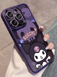 a person holding up a purple phone case with an image of a cat on it