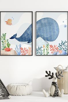 two framed art prints on the wall next to a vase with flowers and seaweed