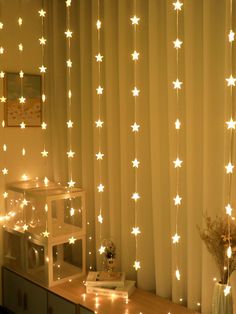 a room with white stars on the curtain