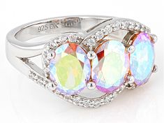 Pre-Owned Bella Luce® champagne aurora borealis and white diamond simulants 6.43ctw oval and round, rhodium over sterling silver ring. Measures approximately 0.81" L x 0.44" W and is not sizable. Diamond equivalent weight is 3.90ctw. .  This product may be a customer return, vendor sample, or on-air display and is not in its originally manufactured condition.  It may not be new.  In some instances, these items are repackaged by JTV. Elegant Iridescent Rings With Accent Stones, Formal Iridescent Oval Ring, Iridescent Oval Jewelry For Anniversary, Iridescent Oval Jewelry For Anniversaries, Formal Iridescent Rings With Accent Stones, Iridescent Rings With Accent Stones For Formal Occasions, Iridescent Rings With Accent Stones For Formal Events, Diamond Simulant, Aurora Borealis