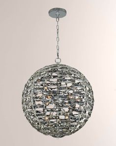 a crystal ball chandelier hanging from a ceiling