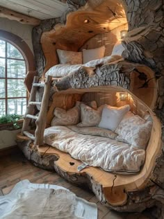 a bed made out of logs with pillows on it