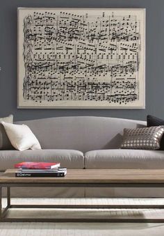 a living room scene with the text take your favorite song and create an oversized sheet music print - you can do this at stages