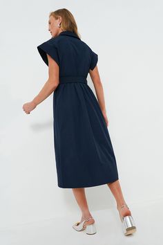 Elegant in its simplicity, the structured and ultra-ladylike Navy Chloe Dress is done in a textured cotton-blend fabric that is sure to turn heads for its design details. The moire pattern throughout and trapunto stitching on the sleeves, placket, and hemline complete this midi moment, making it feel extra special with minimal effort. Pair with heels or flats, sunnies or statement earrings, for day or night, and rest assured that you look fabulous! Spread collar Short wing sleeves Button front p Modern A-line Cotton Dress, Cotton V-neck Dress With Pleated Waist, Chic Cotton Maxi Shirt Dress, Cotton Fitted Maxi Dress For Work, Fitted Cotton Maxi Dress For Work, Modern Cotton A-line Dress, Chic Cotton Dresses With Pleated Waist, Elegant Cotton Dress With Pleated Waist, Modern Fitted Cotton Dresses