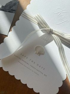 the wedding stationery is laid out on top of each other