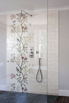 the shower is decorated with flowers and birds