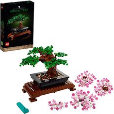 a lego bonsai tree is shown in front of its box and instructions to build it