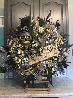 a skull wreath with black and gold decorations