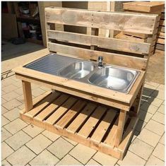 an outdoor sink made out of wooden pallets