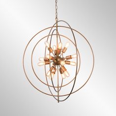 an orb chandelier with lights hanging from it's center and circular metal frame