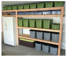 the shelves are filled with plastic containers and bins