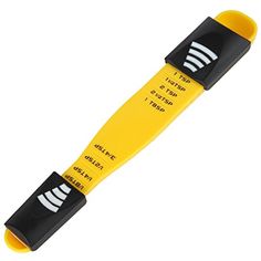 a yellow and black plastic tube with two white stripes on the end, sitting in front of a white background