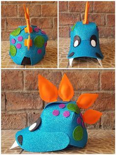 this is a paper mache that looks like a blue fish with orange and green spots