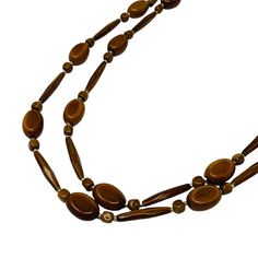 "Vintage 1970s Brown Faux Wood Beaded Long Necklace Beads BRAND: - BEAD WIDTH: slender bead is 1\" long, smaller beads a little over .5\" LENGTH: 27.5\", doubled about 13.5\" CONDITION: great, see photos- coloring lifted on a bead, some imperfection in coloring [5-1900] Like what you see? There's more in the store ↣ https://www.etsy.com/shop/StorylandVintage" Retro Wooden Bead Jewelry, Retro Wooden Round Bead Jewelry, Vintage Multi-strand Beaded Necklaces, Vintage Multi-strand Beaded Necklace, Vintage Wooden Round Beads, Vintage Long Beaded Necklace With Wooden Beads, Vintage Adjustable Long Necklace With Round Beads, Vintage Long Necklace With Adjustable Round Beads, Brown Beaded Necklaces With Oval Beads