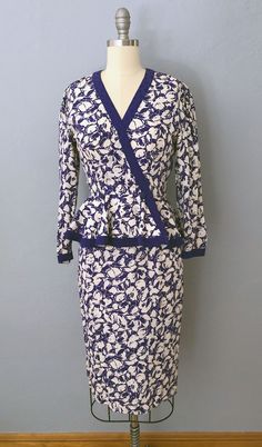 80s does 40's style vintage dress! Ultramarine blue and white floral silk print with silver foil accents. Two piece matching top and skirt. Peplum top wraps, snaps and hooks on the waist. Puffed shoulders and long sleeves. Skirt zips and hooks on the back waist with flared midi length skirt. Bottom flared portion on top is lined. Gorgeous instant vintage style dress that actually accentuates your figure! Fits like a extra small with a waist 24" and under but please double-check measurements below to ensure the best fit for you. MEASUREMENTS--Taken with garment laying flat, in inches, doubled: Bust: 34" Waist: Top: 24"; Skirt: 24" Hips: 36" Shoulders: 14" Shoulder to waist: 16" Sleeves: 21" Length: Top: 41"; Skirt: 26" Fabric: Silk, hook n eye, nylon zipper Label/Era: Maggy London Jeannene Fitted Floral Print Peplum Dress, Matching Top And Skirt, Dress Peplum, 40s Style, 2 Piece Dress, Peplum Skirt, Blouse Skirt, 40s Fashion, 80s Dress