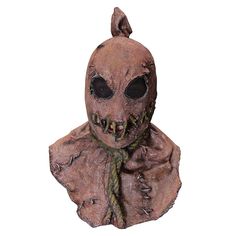 a creepy looking mask with teeth and fangs on it's face, sitting in front of a white background