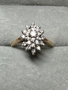 For your consideration, a 14K yellow gold CZ cluster ring.  It is hallmarked 14K and guaranteed to be such. It features graduated stones spanning the top to bottom. The top stone measure 2.5mm, mid-levels stones are 2mm stones and the bottom level are 1mm stones. The setting measures 14mm x 10mm.  It is a size 4 3/4 and weighs in at 3.8 grams.  Love sparkle?  Here's your ring! Luxury Silver Dazzling Cluster Ring, Luxury Gold Vintage Cluster Ring, Luxury Silver Cluster Ring Collectible, Luxury Exquisite Gold Cluster Ring, Luxury Vintage White Cluster Ring, Luxury Antique Hallmarked Cluster Ring, Service Merchandise Diamond Cluster Ring 1970s, 14k Gold Cluster Diamond Ring With Prong Setting, Cluster 14k Gold Diamond Ring For Anniversary