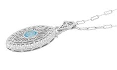 Gracefully elegant, this beautiful Art Deco blue topaz pendant necklace in solid sterling silver spotlights a dazzling oval brilliant cut sky blue topaz ( December Birthstone ) of 1.50 carat in a secure high polish bezel setting. Filigree openwork radiates from the center of the pendant, with a double oval filigree scallop and scroll open work frame surrounding the outer edges. The finished open gallery around the sides of the pendant and the generously sized arrowhead filigree bail complete the Silver Oval Topaz Necklaces, Oval Blue Topaz Filigree Jewelry, Blue Topaz Pendant Necklace, Oval Pendant Necklace, Deco Blue, Blue Topaz Pendant, Topaz Pendant, Sky Blue Topaz, Oval Pendant