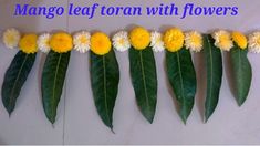 yellow and white flowers are lined up on the side of a wall with words that read mango leaf torun with flowers